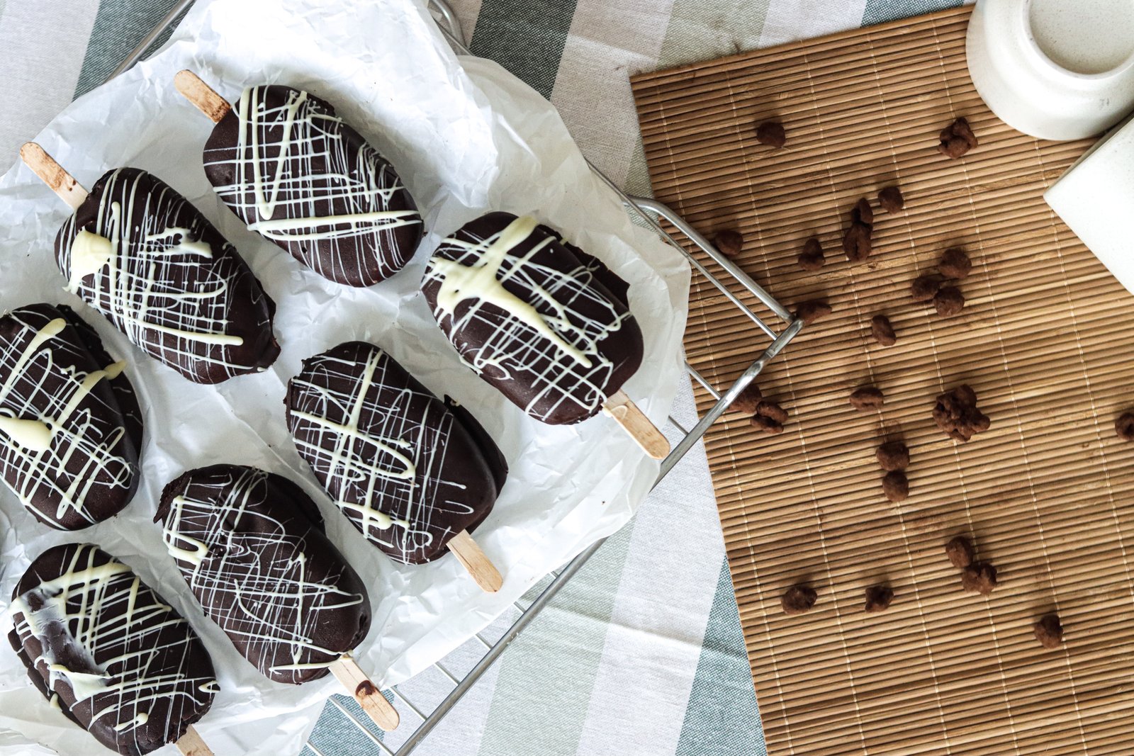 Chocolate cakesicles with white chocolate drizzle