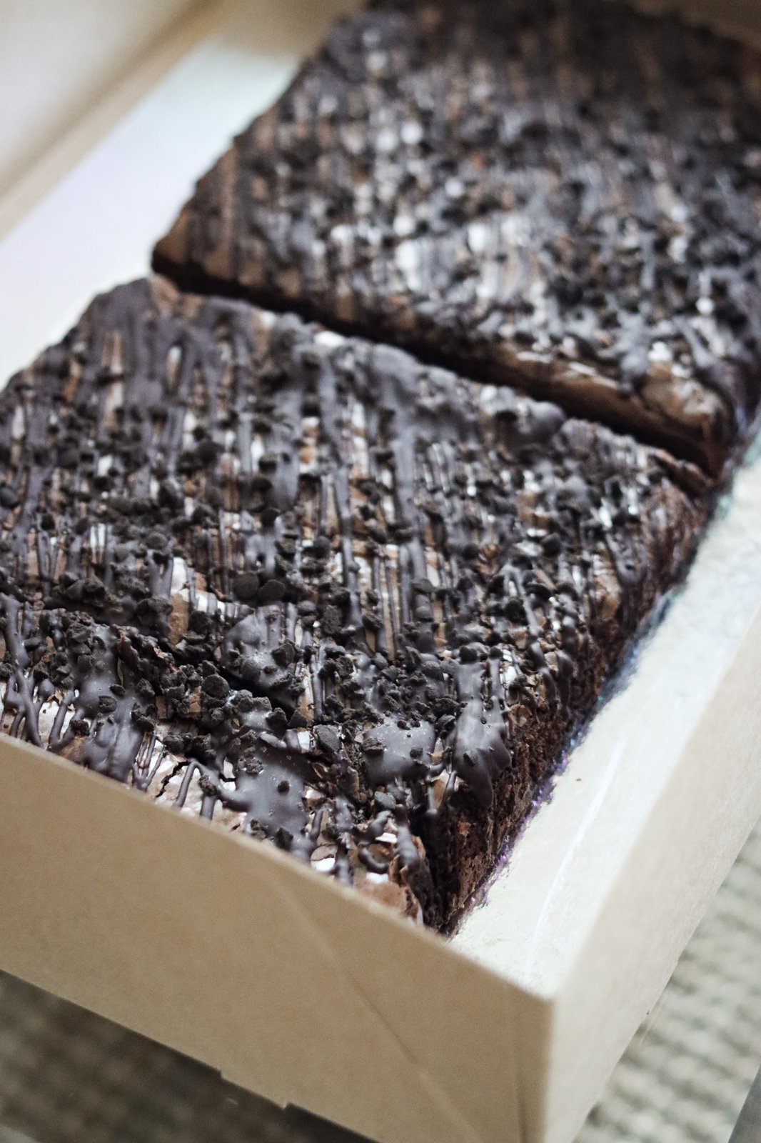 Chocolate brownies boxed by SweetSpot Cakes
